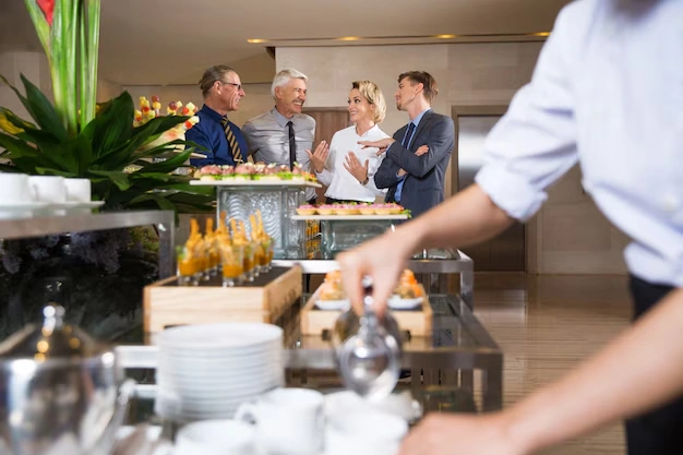 group-of-people-talking-at-business-event-with-snacks-and-drinks