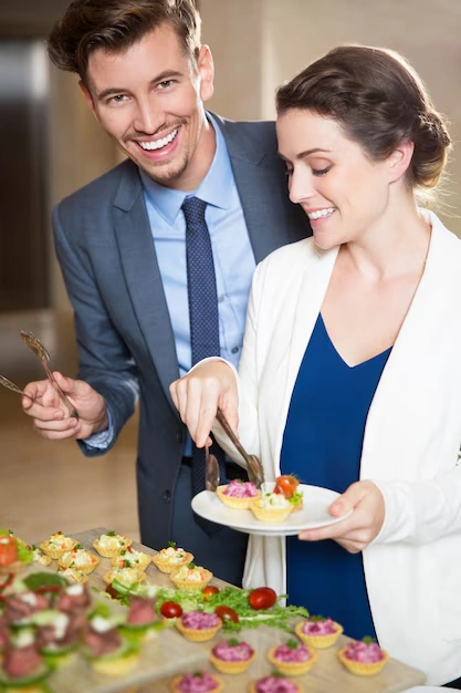 two-people-enjoying-finger-food-at-elegant-event